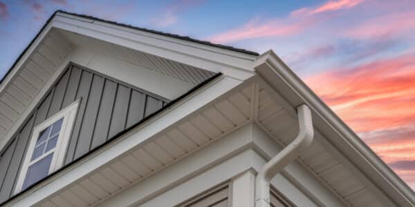 White vinyl soffit and fascia on a modern Ottawa home against a colorful sunset sky.