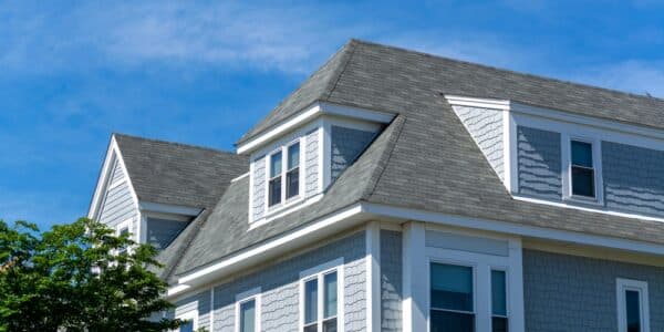 Beautiful,Family,Home,Facade,With,Steep,Roof,And,Dormer,Windows